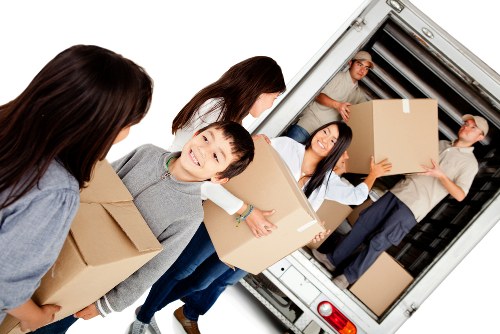 Removal team preparing a house move in Hackney street setting