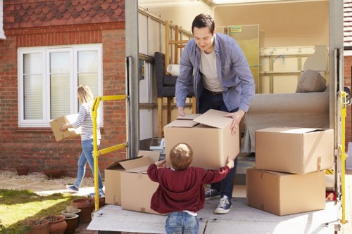 Packed moving boxes and labels in a Hackney property