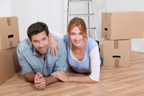 Commercial movers handling desks and equipment in East London