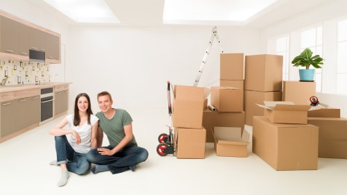Packed boxes and furniture ready for removal van transport