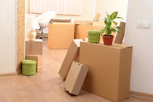 Loading furniture into a removals van on a Hackney street