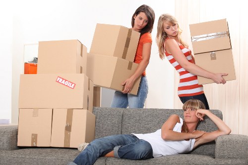 Professional removals crew demonstrating safe handling practices