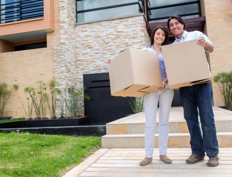 Local moving truck handling furniture and boxes in Hackney