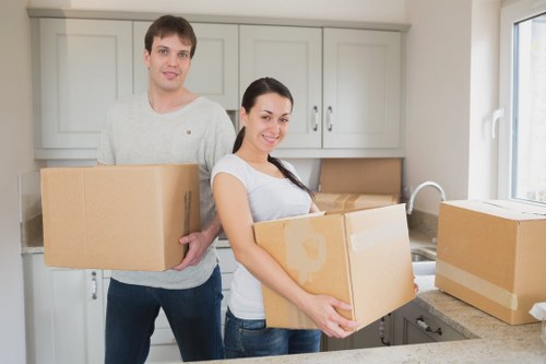 Local moving team navigating Hackney streets with boxes and furniture